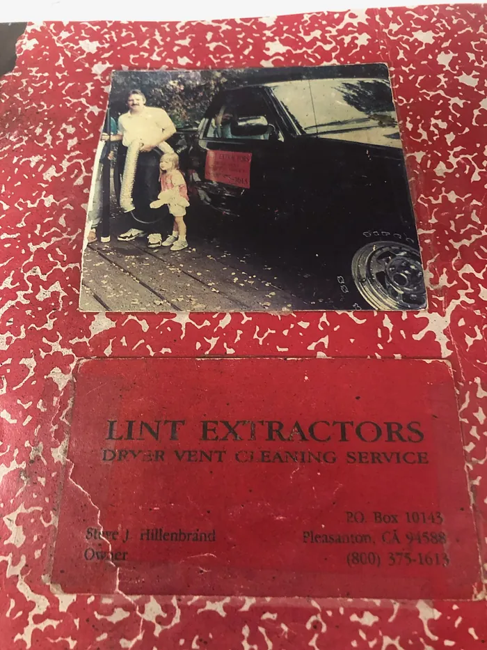 A scrapbook page: a 1990s photo of Steve and his young daughter beside the first Lint Extractors truck, above his original business card